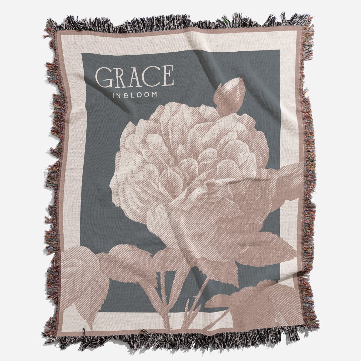 Floral blanket with 'Grace in Bloom' text on a gray background