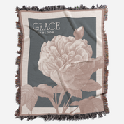 Floral blanket with 'Grace in Bloom' text on a gray background