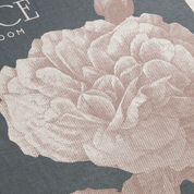 Close-up of a textured fabric with floral pattern on a dark background