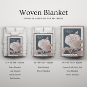 Woven blanket with floral design on a light gray background, showing different sizes.