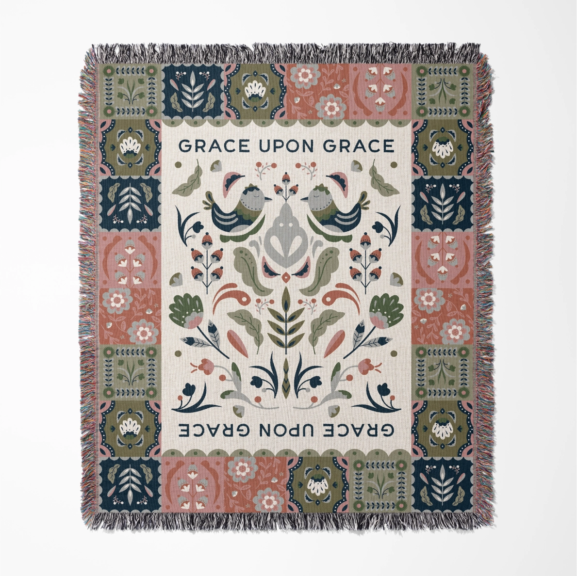 Faith-inspired woven blanket featuring the phrase “Grace Upon Grace” with colorful fringed edges, perfect for Christian home decor and gifts.