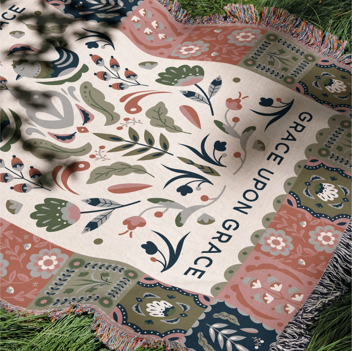 Faith-inspired woven blanket featuring the phrase “Grace Upon Grace” with colorful fringed edges, perfect for Christian home decor and gifts.