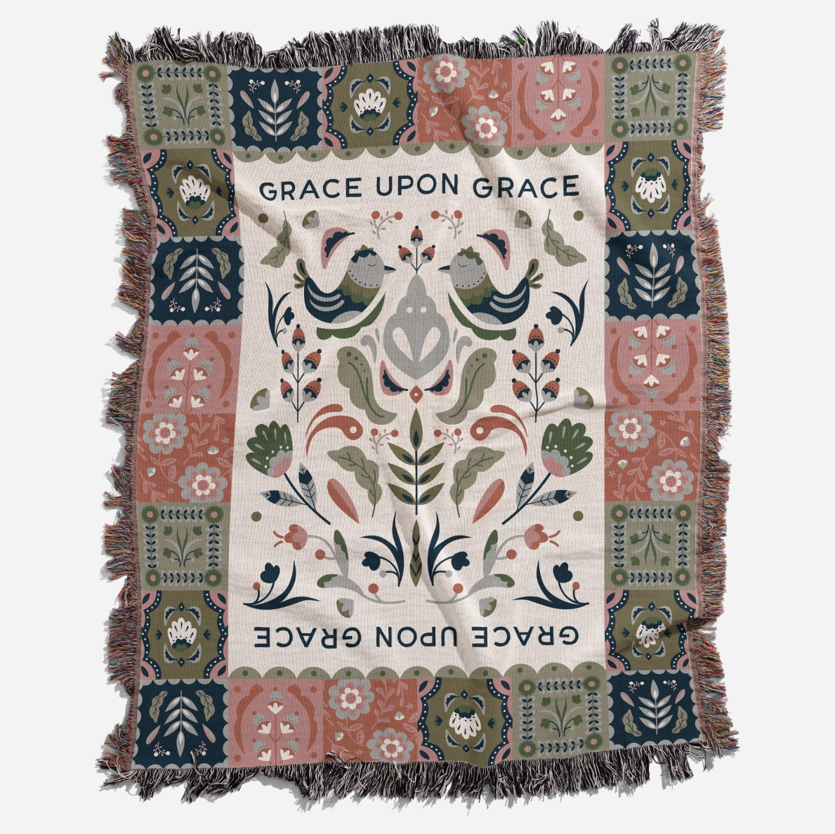 Faith-inspired woven blanket featuring the phrase “Grace Upon Grace” with colorful fringed edges, perfect for Christian home decor and gifts.