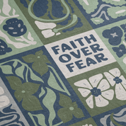 Decorative mat with floral patterns and 'Faith Over Fear' text