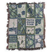 Decorative blanket with floral and animal patterns and 'Faith Over Fear' text on a white background