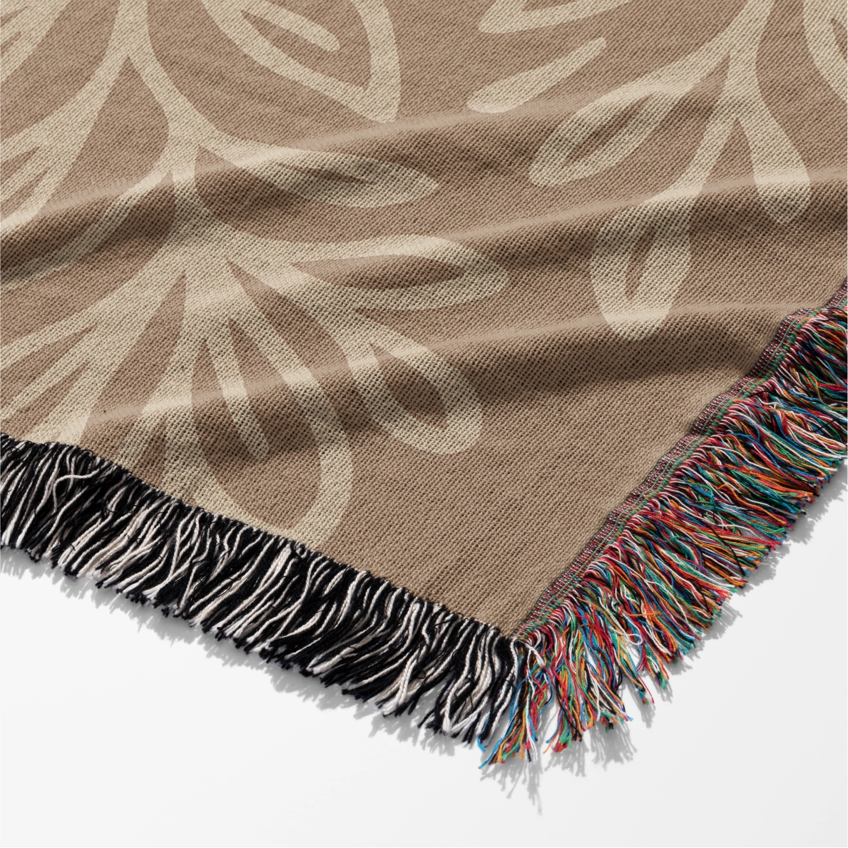 Neutral-toned woven blanket with the phrase "Grow in Grace" surrounded by elegant floral design; made from 100% cotton with fringe, perfect Christian gift or decor.