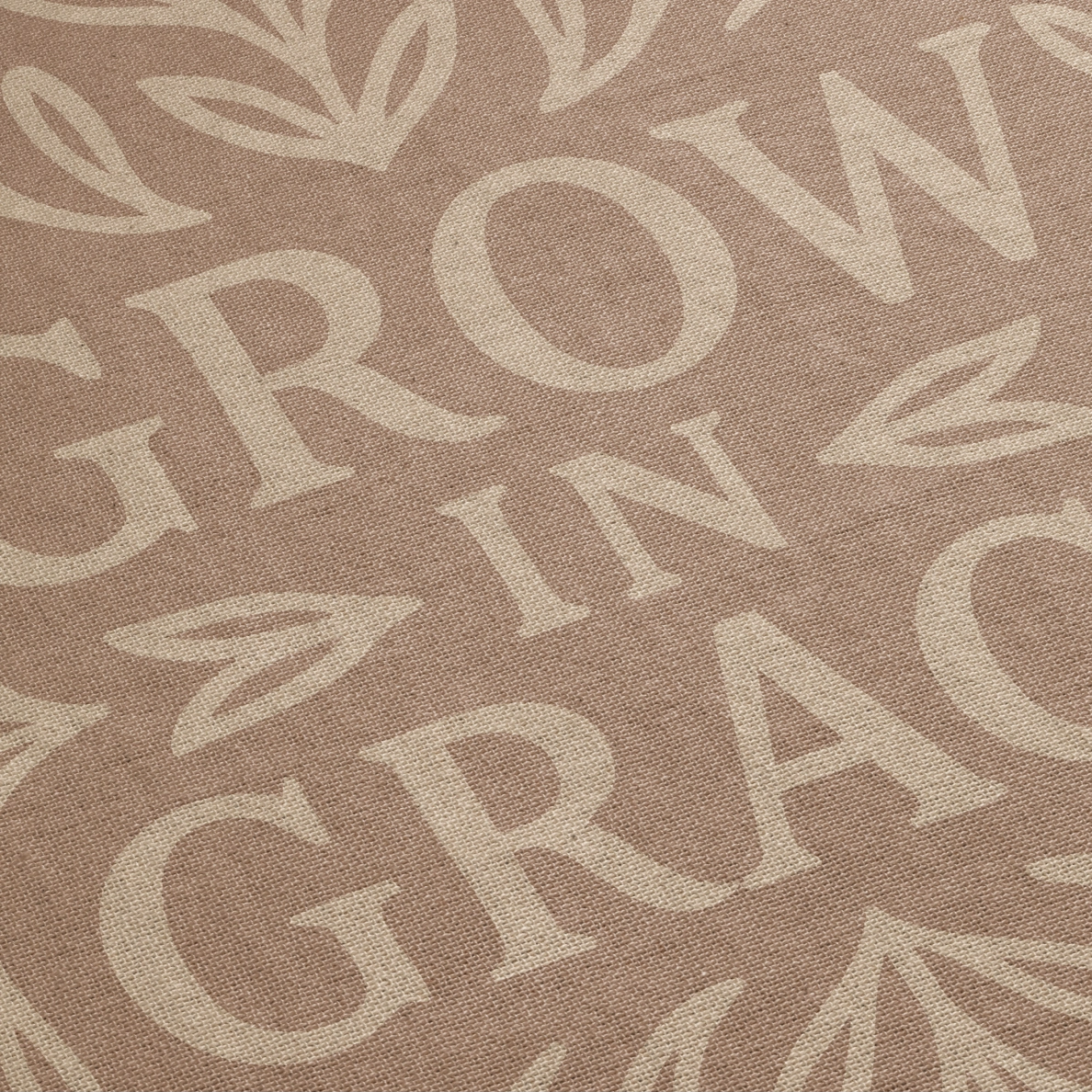 Neutral-toned woven blanket with the phrase "Grow in Grace" surrounded by elegant floral design; made from 100% cotton with fringe, perfect Christian gift or decor.