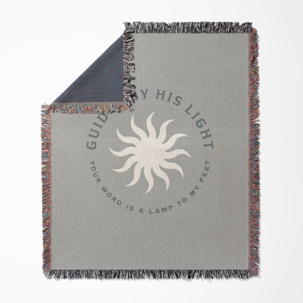 Gray blanket with sun design and text on a white background