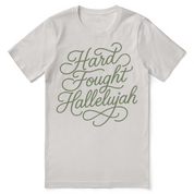 Christian t-shirt with hand-lettered “Hard Fought Hallelujah” design; unisex cotton tee for faith, perseverance, and praise through hardship.