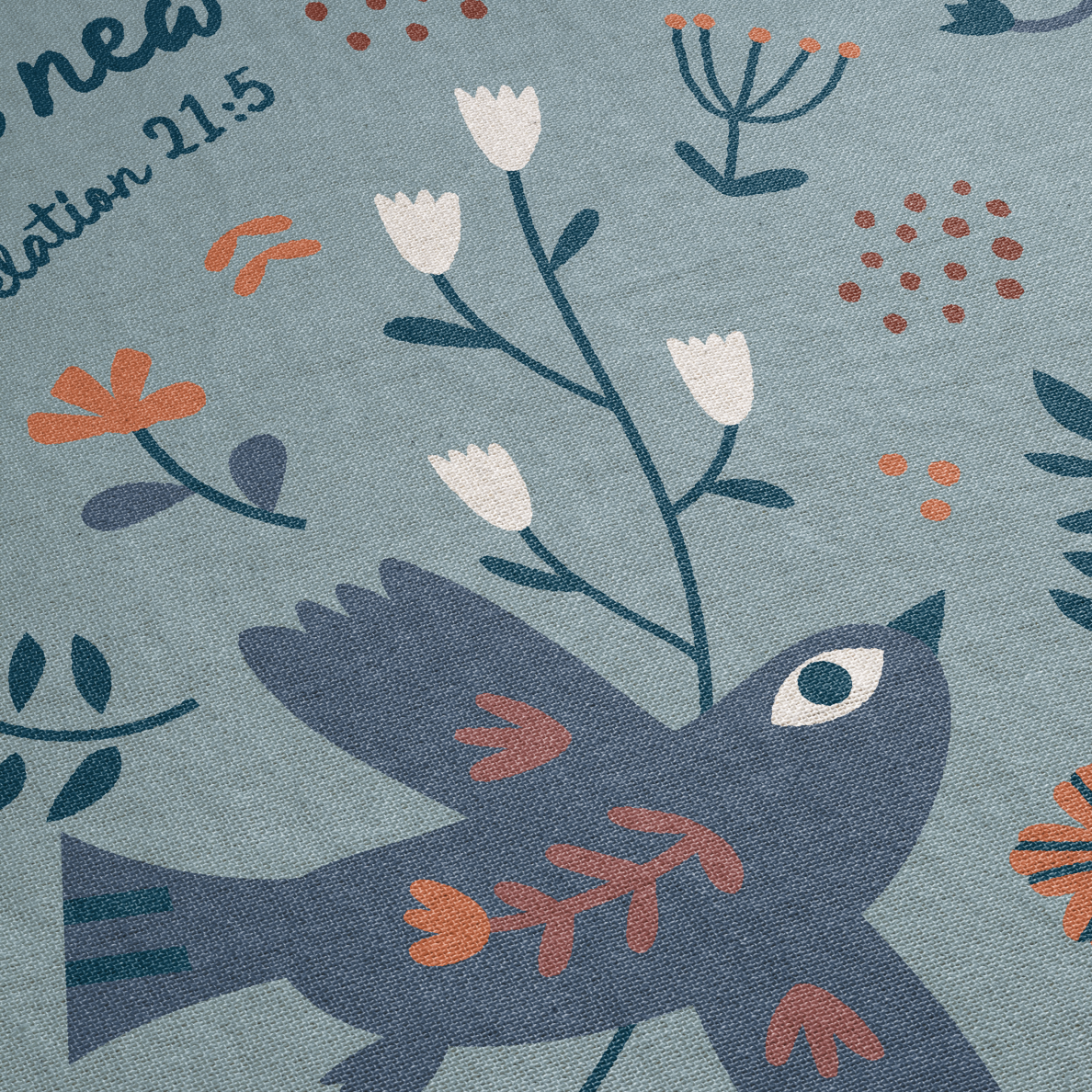 Details on blanket - bird and text.