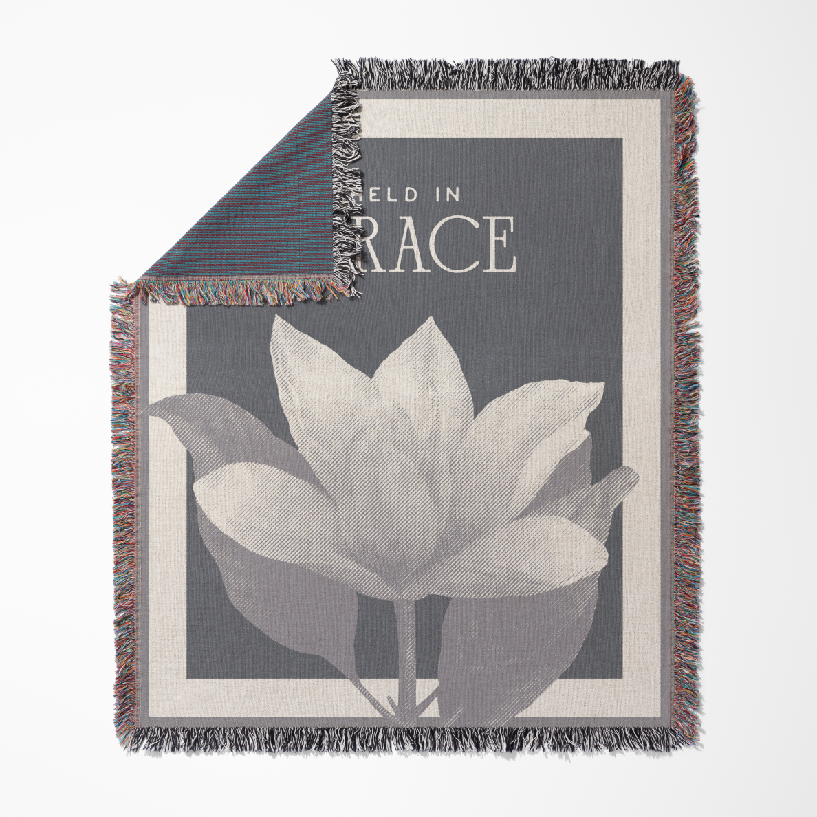 Blanket with floral design and text on a gray background