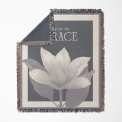 Blanket with floral design and text on a gray background