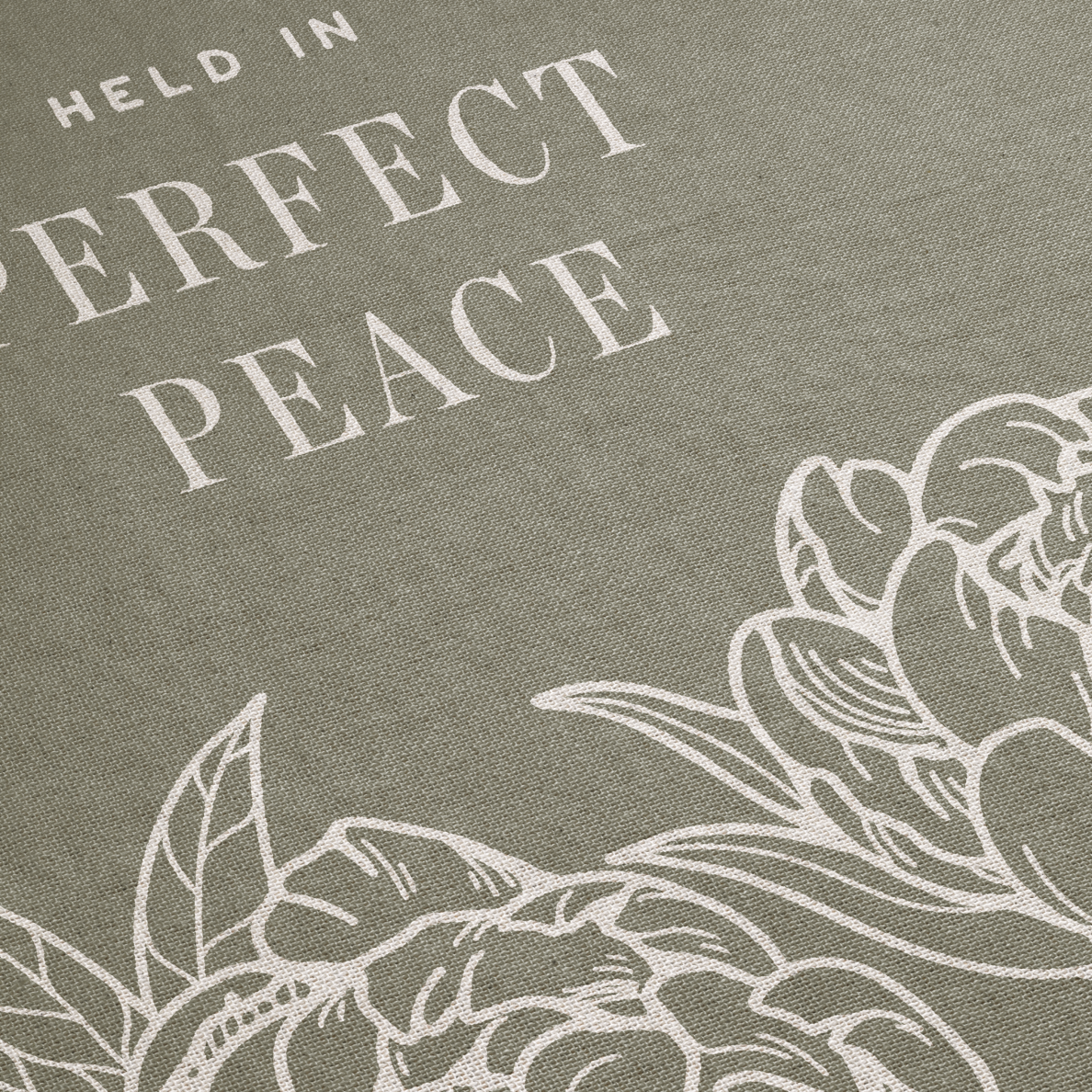 Text 'HELD IN PERFECT PEACE' with floral design on a gray background
