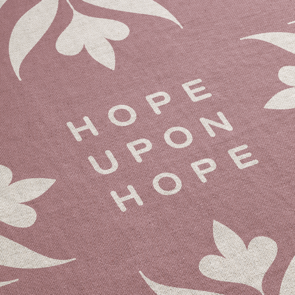 Text 'Hope Upon Hope' on a pink background with floral patterns