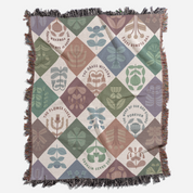 Decorative blanket with geometric pattern and text on a white background