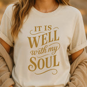 Christian t-shirt with hand-scripted “It Is Well With My Soul” text; soft unisex cotton tee inspired by hymn lyrics, perfect for peace-filled everyday faith and gifting.