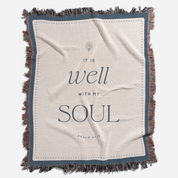 Blanket with 'It is well with my soul' text on a white background