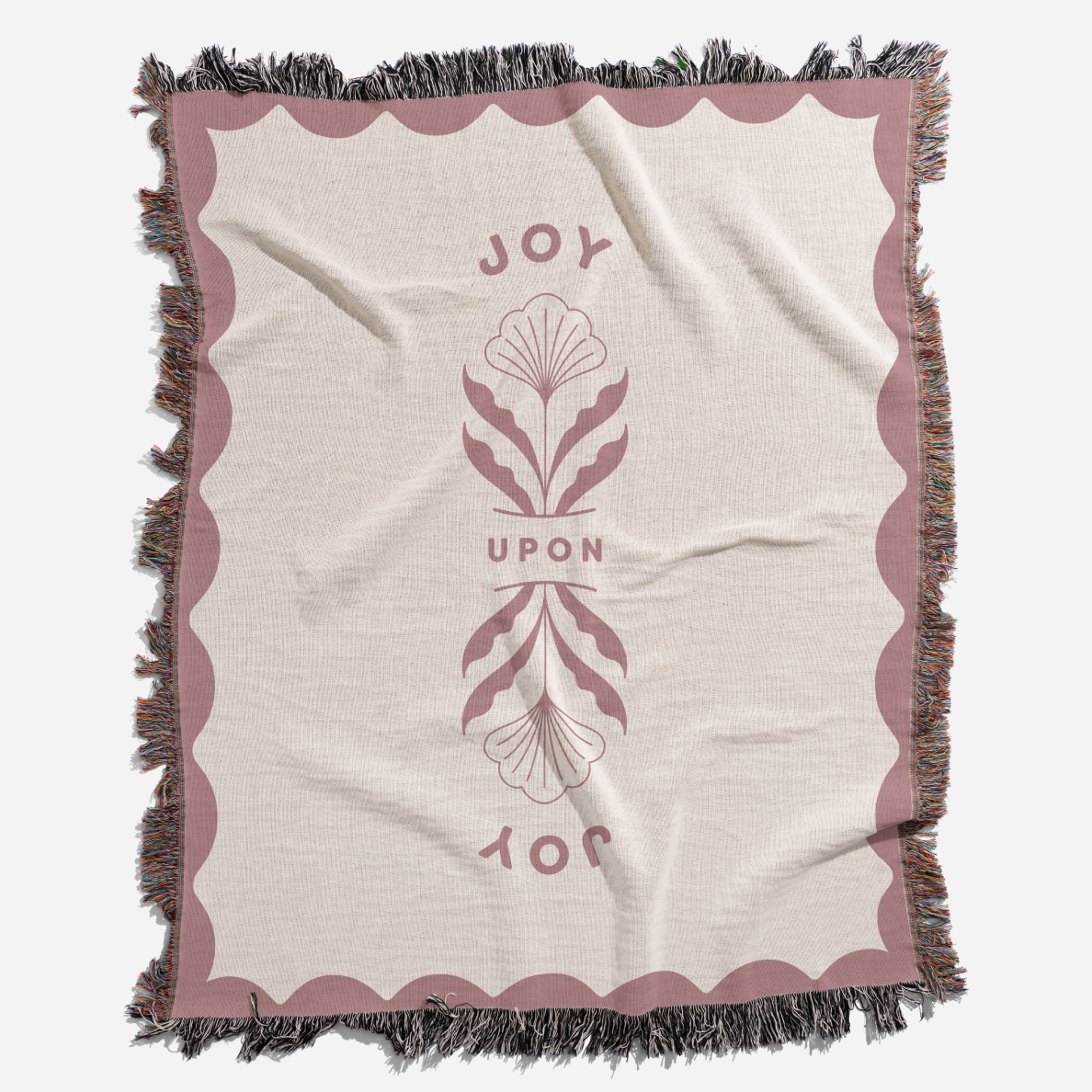 Blanket with decorative border and central design on a white background