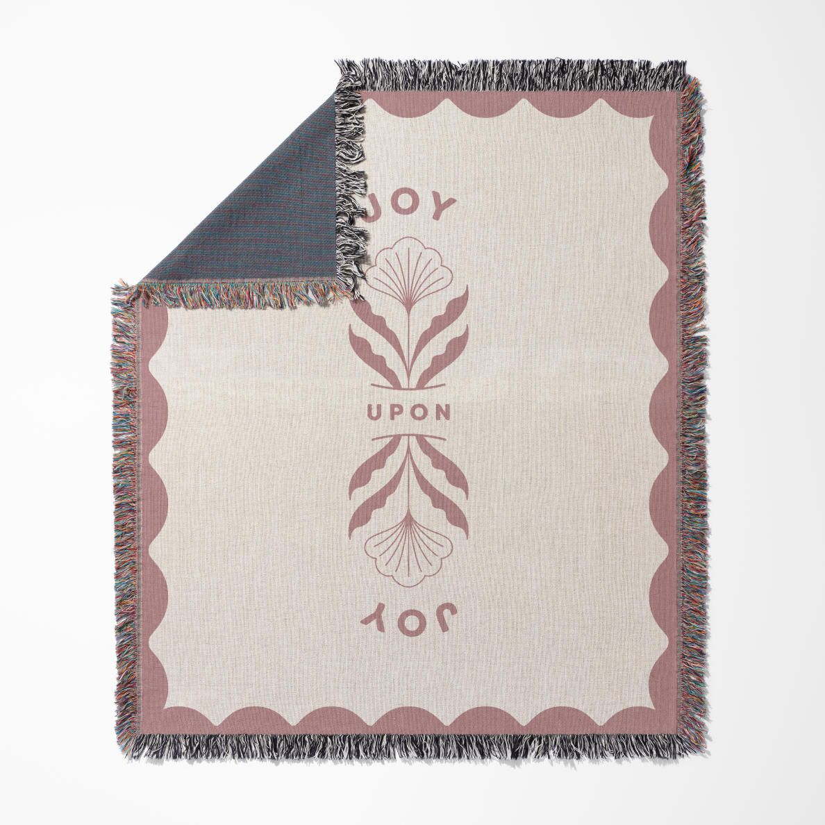 Blanket with decorative border and text on a white background