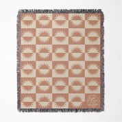 Neutral-toned woven blanket with suns and the phrase “This little light of mine, I’m gonna let it shine,” made from 100% cotton with fringe; perfect for nurseries or Christian baby gifts.