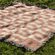 Neutral-toned woven blanket with suns and the phrase “This little light of mine, I’m gonna let it shine,” made from 100% cotton with fringe; perfect for nurseries or Christian baby gifts.