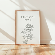 Framed artwork with floral design and text on a wall