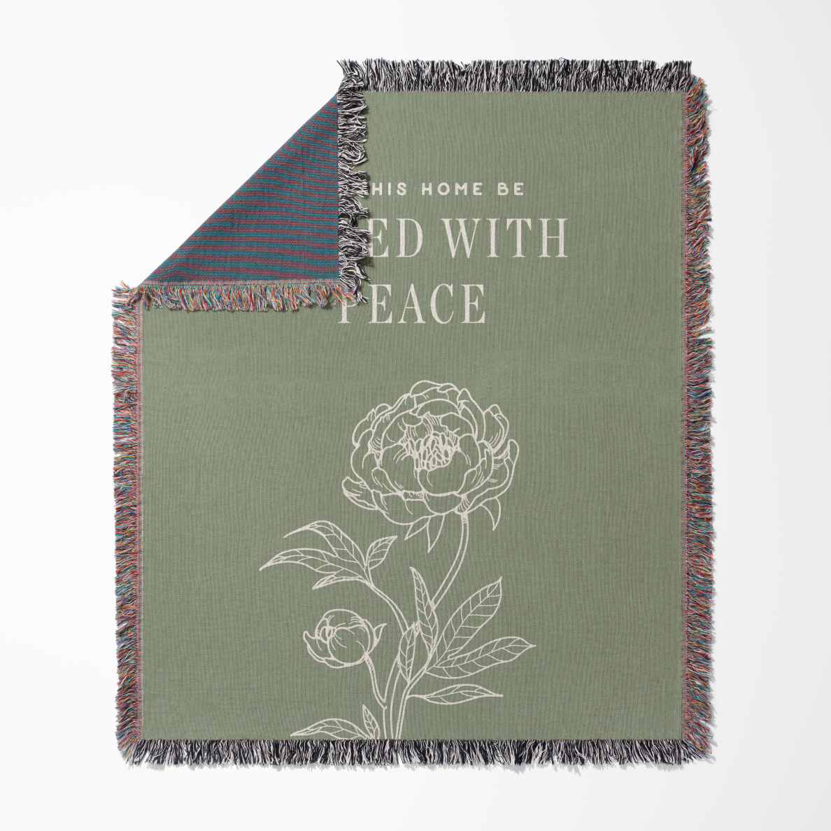 Green blanket with floral design and text on a white background