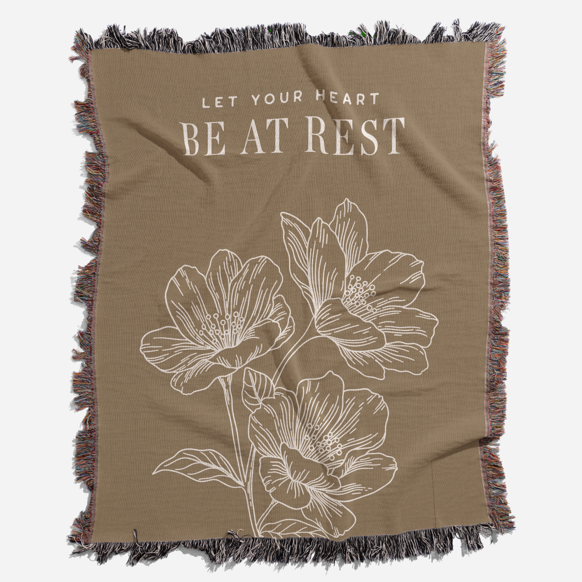 Brown blanket with floral design and text 'Let Your Heart Be at Rest'