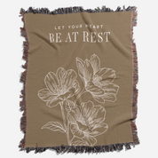 Brown blanket with floral design and text 'Let Your Heart Be at Rest'