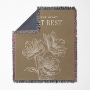Floral-patterned blanket with text on a beige background