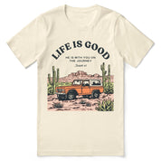 Christian t-shirt with the phrase “Life Is Good – Journey With Him”; soft unisex tee for everyday faith, encouragement, and walking with Jesus.