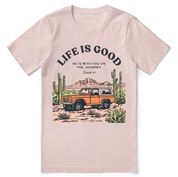 Christian t-shirt with the phrase “Life Is Good – Journey With Him”; soft unisex tee for everyday faith, encouragement, and walking with Jesus.