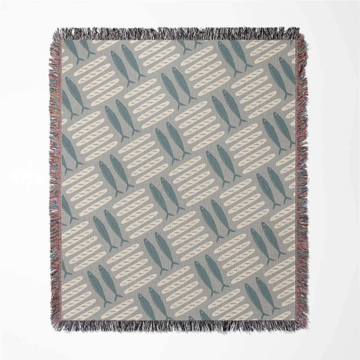 Woven Christian blanket featuring loaves and fishes pattern inspired by the miracle of Matthew 14; 100% cotton with fringe, a symbol of God’s provision and abundance.