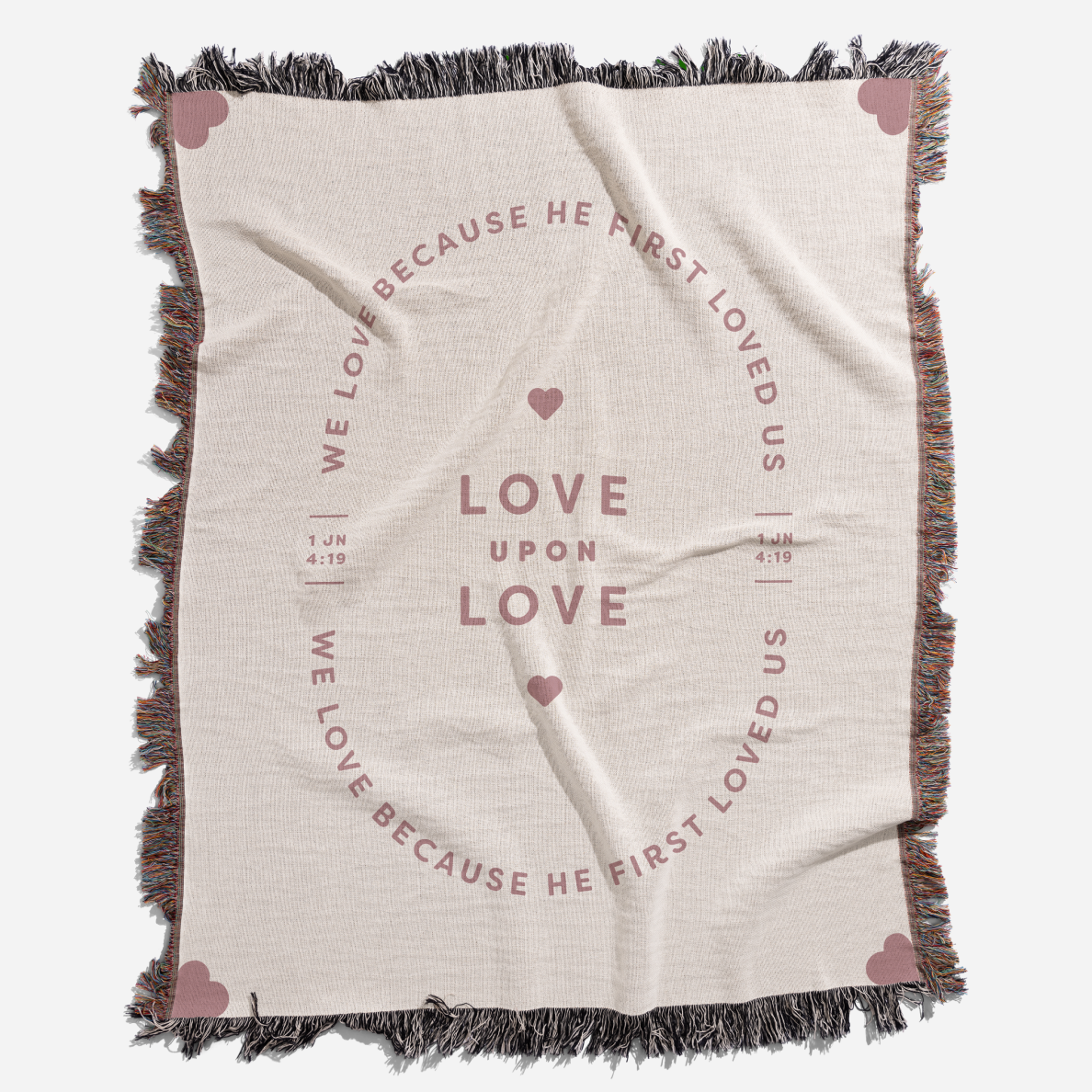 Blanket with text and heart designs on a white background