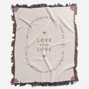 Blanket with text and heart designs on a white background