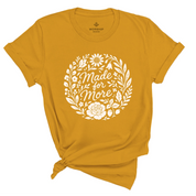 Christian t-shirt with “Made for More” in handwritten script surrounded by flowers and plants; soft cotton unisex tee symbolizing faith, growth, and divine purpose.