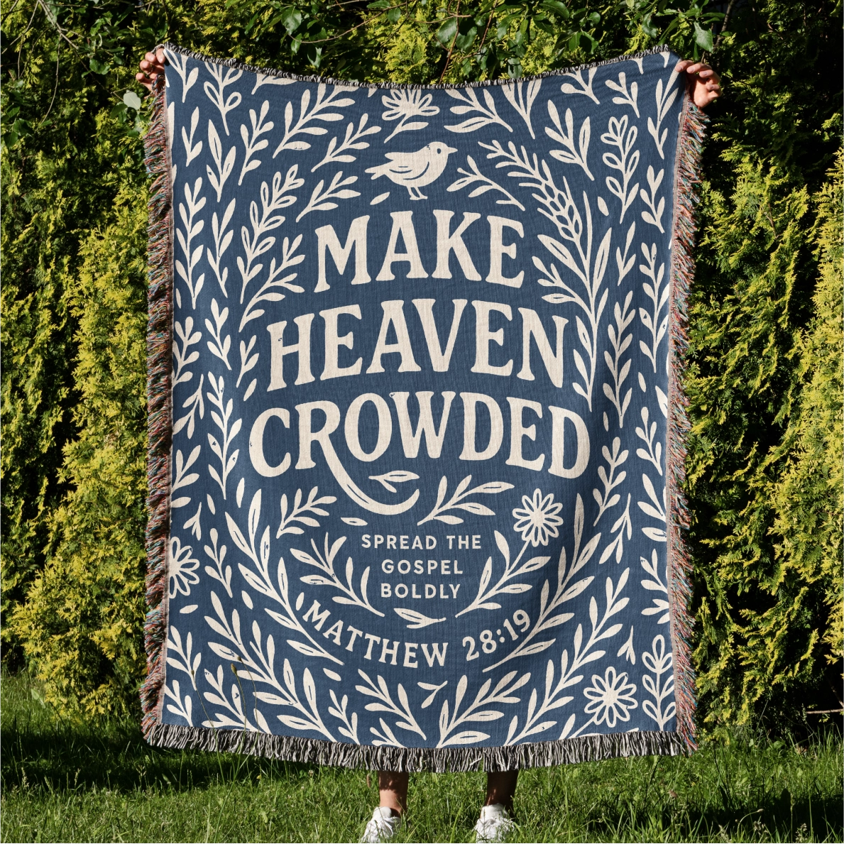 Woven Christian blanket with the phrase "Make Heaven Crowded" and a simple floral design, made of 100% cotton with fringed edges; perfect faith-based gift or home decor.