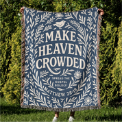 Woven Christian blanket with the phrase "Make Heaven Crowded" and a simple floral design, made of 100% cotton with fringed edges; perfect faith-based gift or home decor.