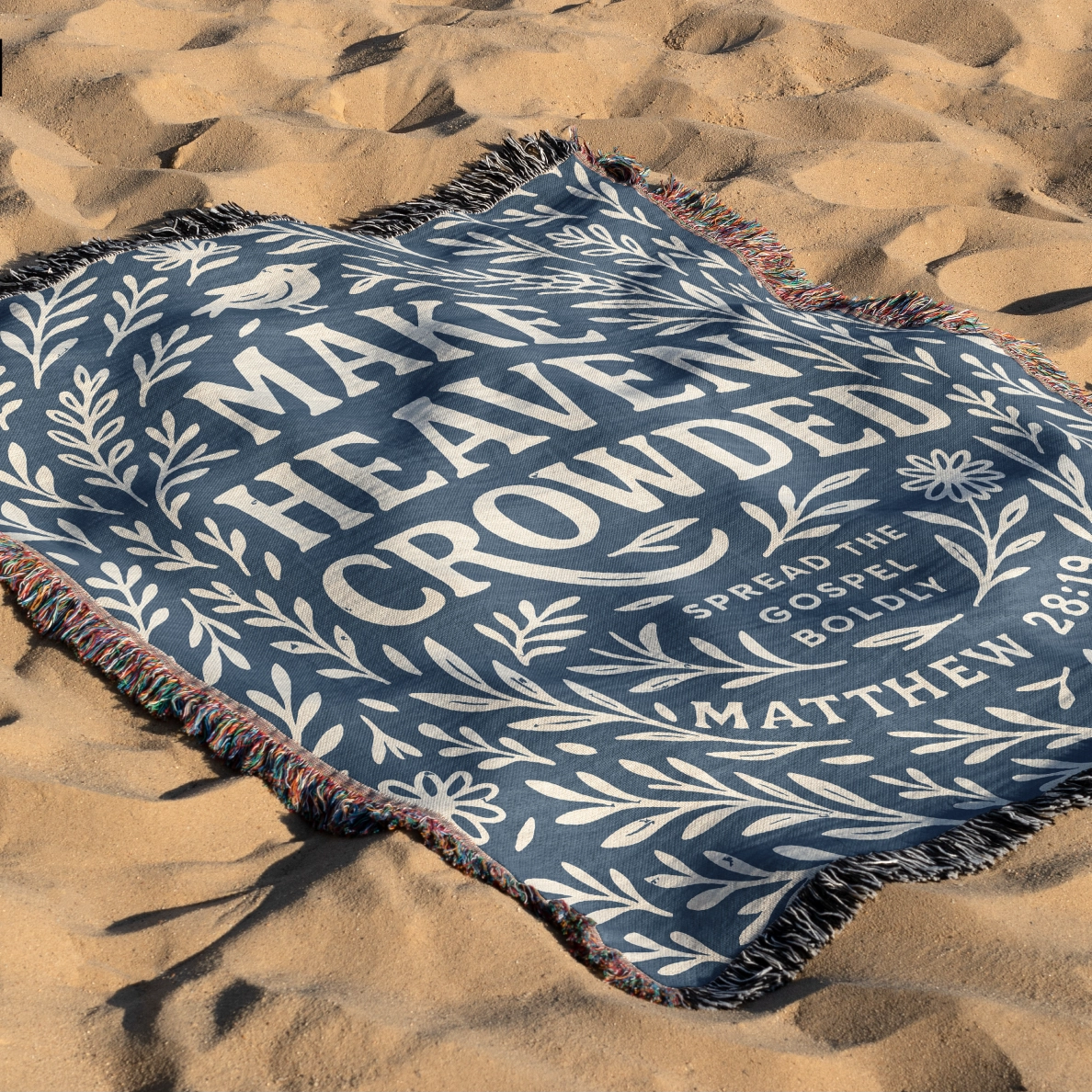 Woven Christian blanket with the phrase "Make Heaven Crowded" and a simple floral design, made of 100% cotton with fringed edges; perfect faith-based gift or home decor.