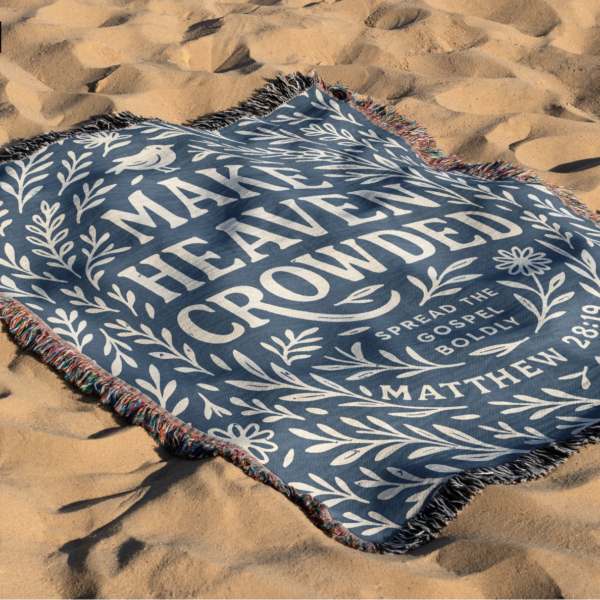 Woven Christian blanket with the phrase "Make Heaven Crowded" and a simple floral design, made of 100% cotton with fringed edges; perfect faith-based gift or home decor.
