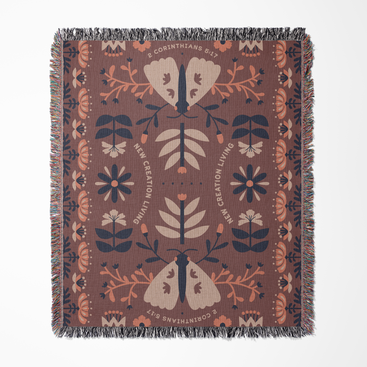 Decorative blanket with floral and butterfly pattern on a brown background