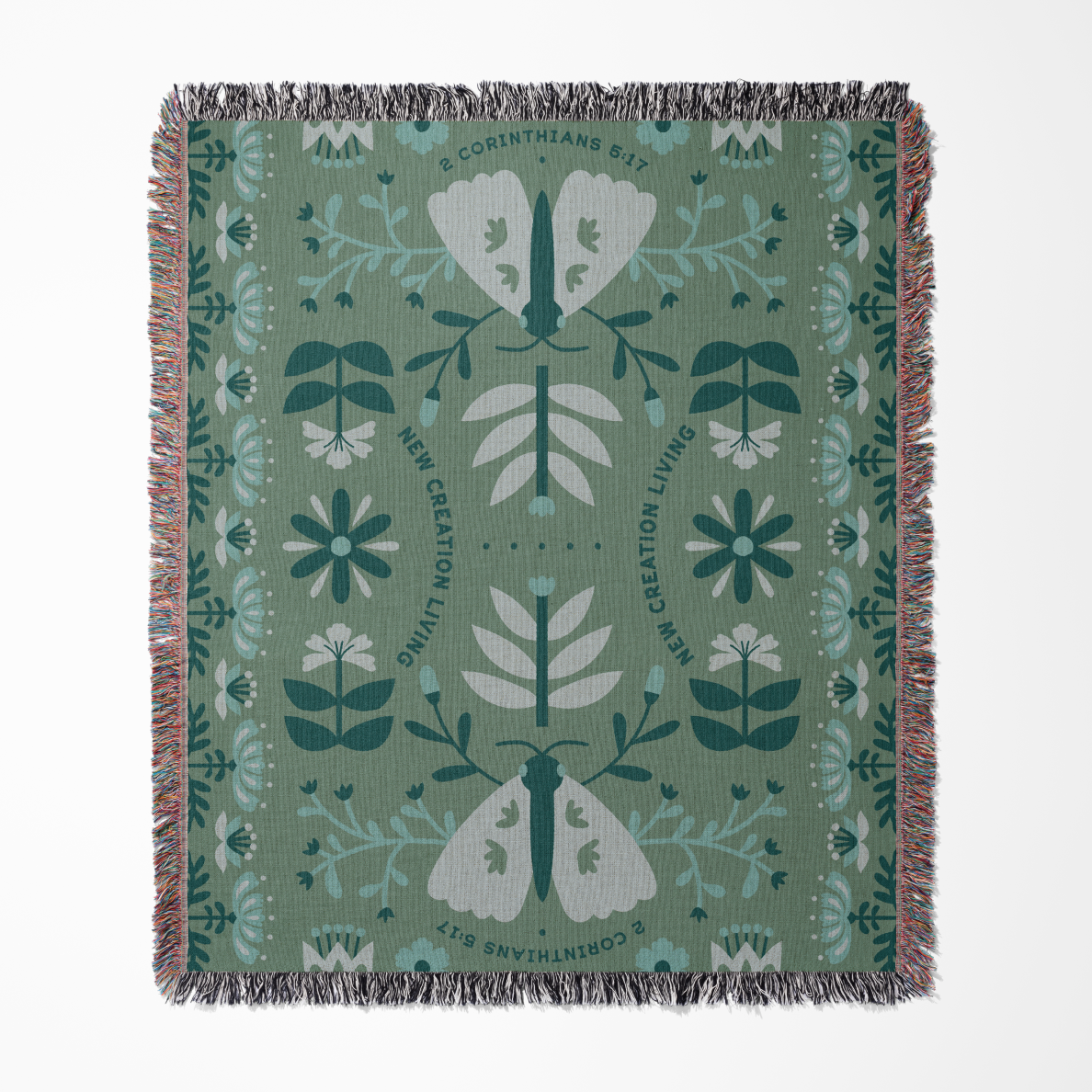Decorative blanket with moth and floral pattern on a green background