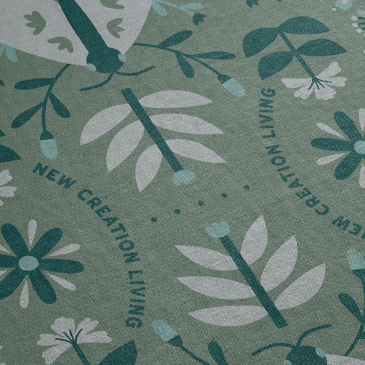 Floral pattern with 'New Creation Living' text on a green background