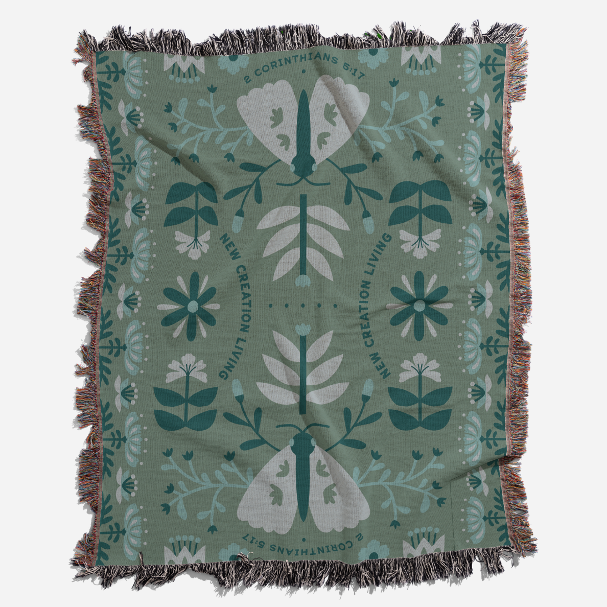 Decorative blanket with moth and floral pattern on a green background