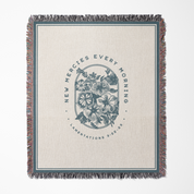 Blanket with floral design and text on a white background