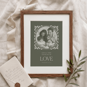 Framed family photo with decorative text on a textured surface