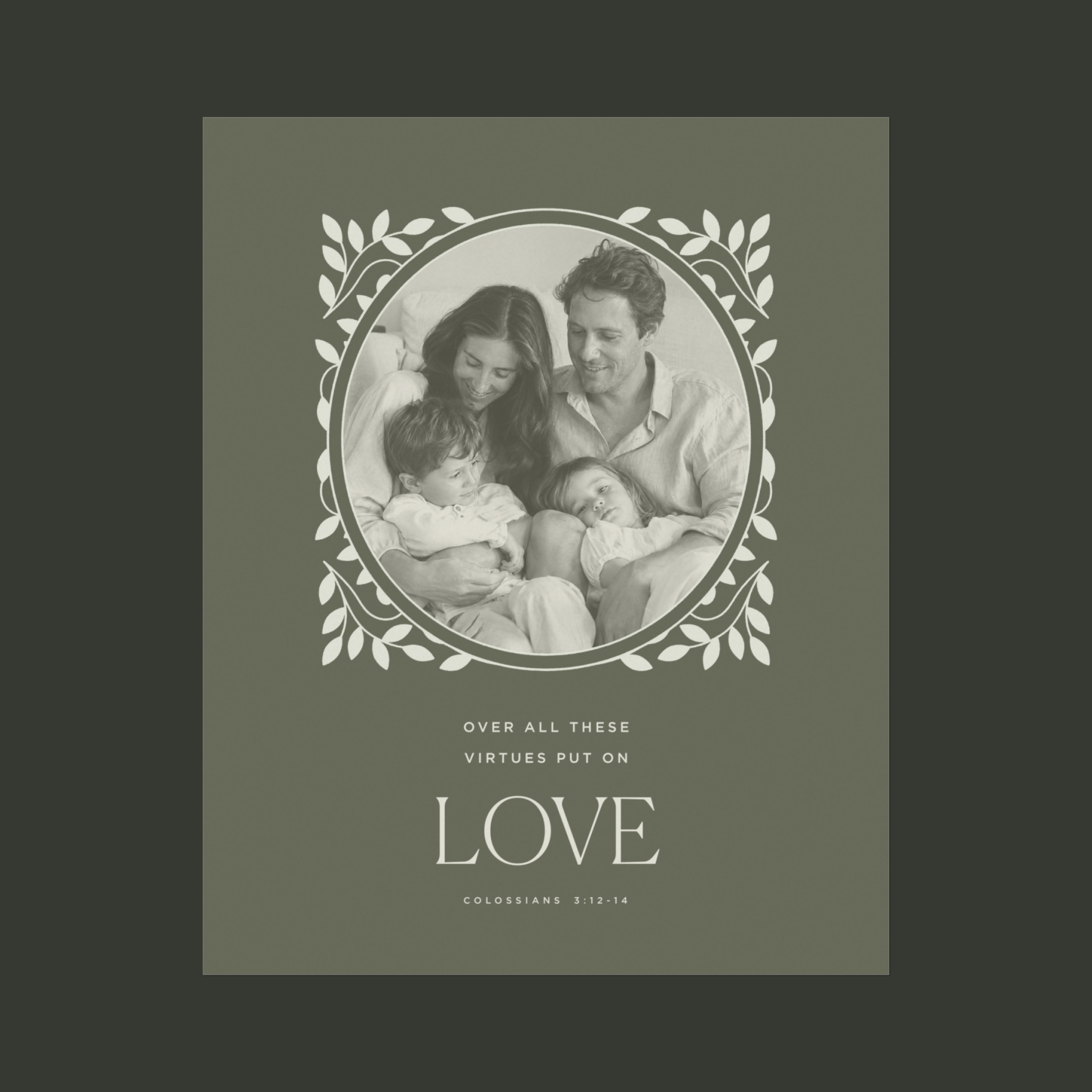 A square printed card or poster with an olive green background and a central oval photo of a family, surrounded by a white leafy border. Below the photo, the text reads 'OVER ALL THESE VIRTUES PUT ON LOVE' with 'COLOSSIANS 2:12-14' underneath.