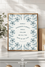 Framed artwork with floral design and text on a wall, featuring the brand 'Worship Wares'.
