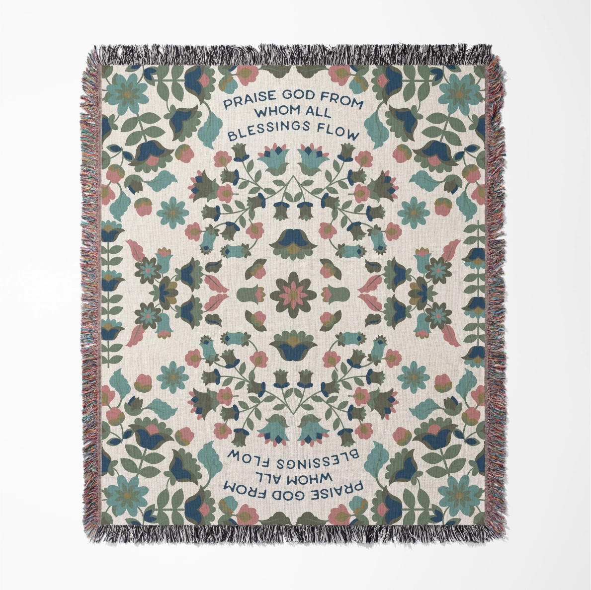Christian throw blanket with garden-inspired folk art design and the phrase 'Praise God from whom all blessings flow' in soft cottage colors