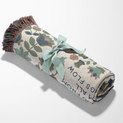 Christian throw blanket with garden-inspired folk art design and the phrase 'Praise God from whom all blessings flow' in soft cottage colors